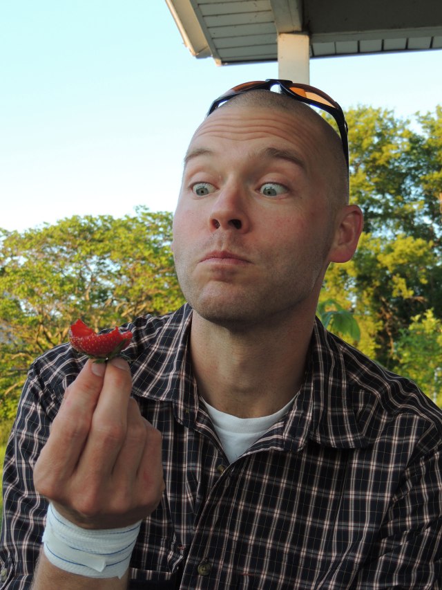 John eating strawberry