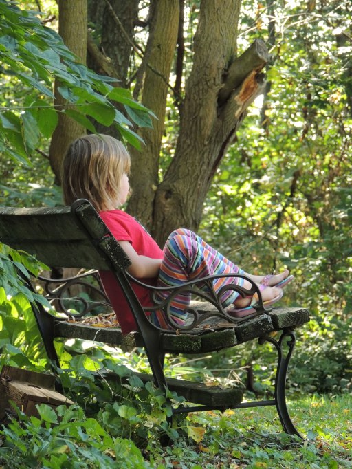 Clara sitting on bench.