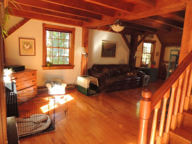 The table with the girls at it is in the far corner of the picture and you are now standing in front of the back door.