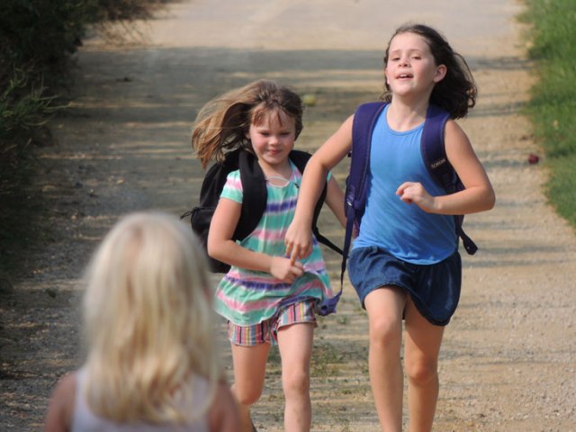 Ivy and Clara running up driveway